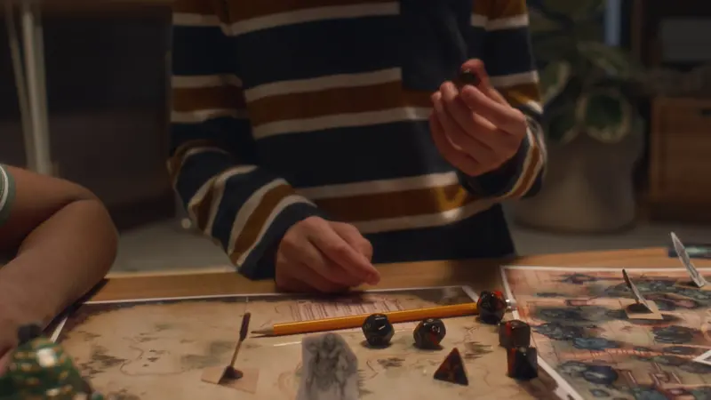 Polyhedral dice on a hand-drawn fantasy map